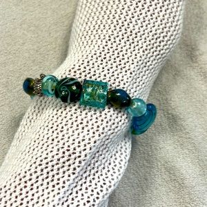 Multi beaded bracelet. Costume jewelry. Stretchy.